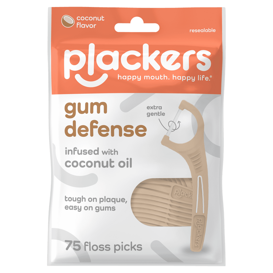 Front-facing resealable pouch of Plackers Gum Defense floss picks featuring coconut oil branding and a beige floss pick image.