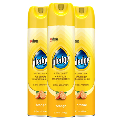 Three yellow Pledge Expert Care orange-enhancing aerosol cans shown side-by-side on white background.