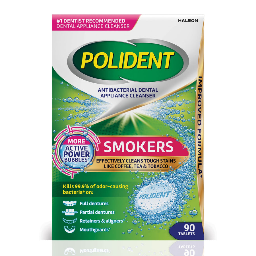 Front-facing Polident Smokers antibacterial dental appliance cleanser box with green background and visible 'Smokers' callout and tablet graphic