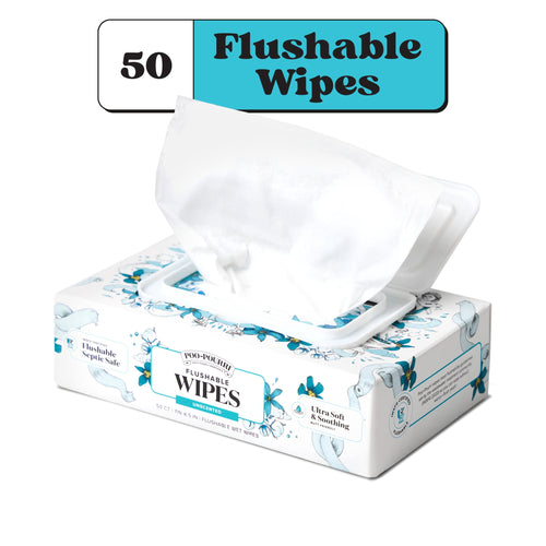 Poo-Pourri flushable wipes box with white wipe pulled from flip-top lid, floral blue packaging on white background