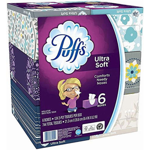 Puffs Ultra Soft multipack with purple front panel showing the Puffs logo, cartoon girl illustration and '6 boxes' text.