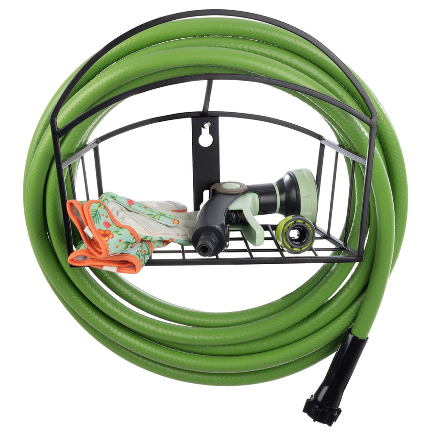 Black metal wall-mounted hose holder with a green garden hose, spray nozzle and floral gardening gloves stored on the shelf