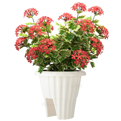 White plastic railing planter with decorative rim holding variegated green foliage and red flowers