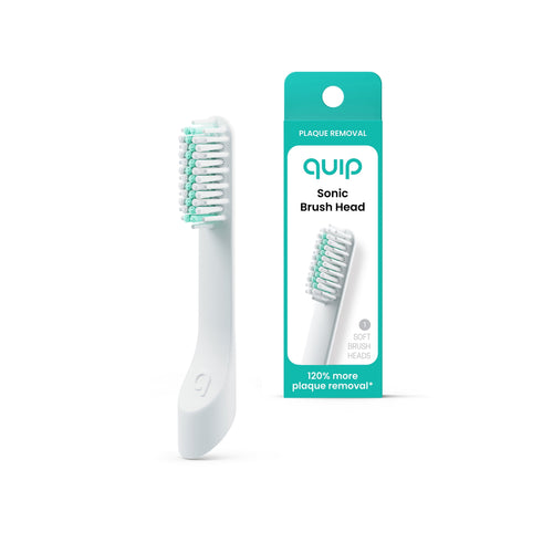 Quip soft sonic replacement brush head shown beside its teal-and-white retail box on white background