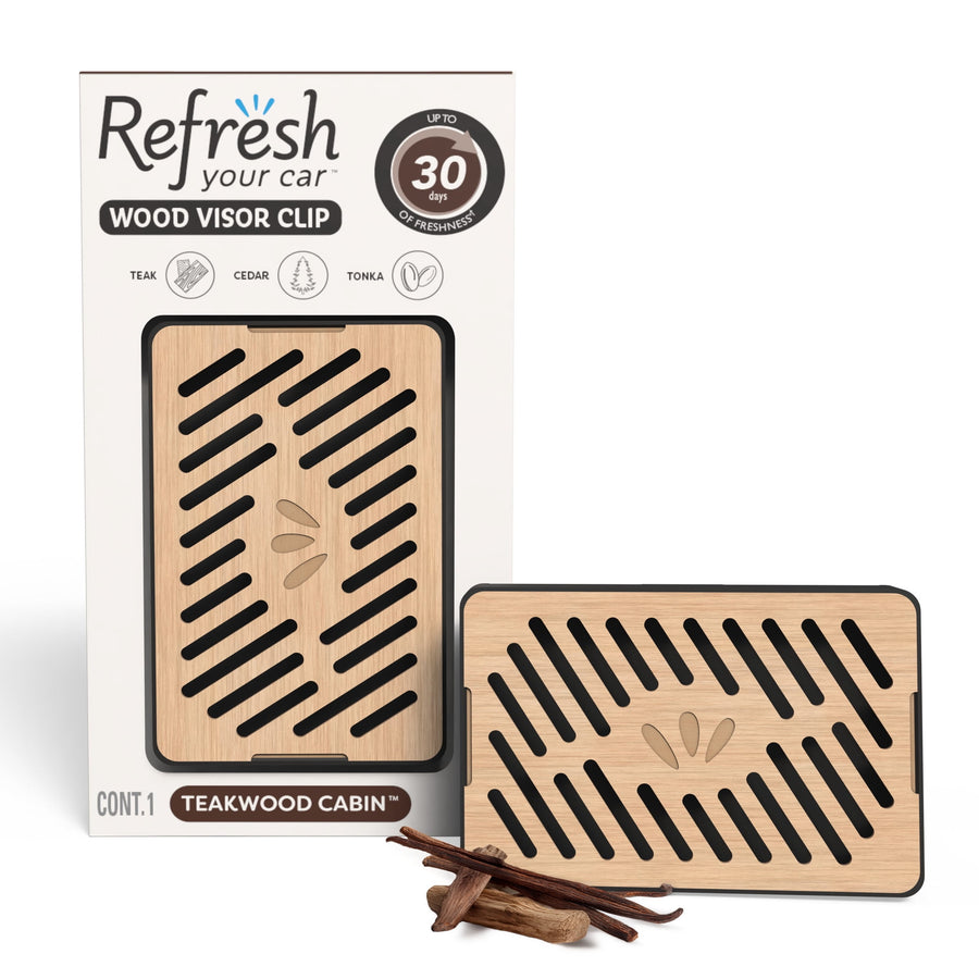 Wood-grain rectangular car visor clip air freshener next to its Refresh Your Car branded Teakwood Cabin packaging