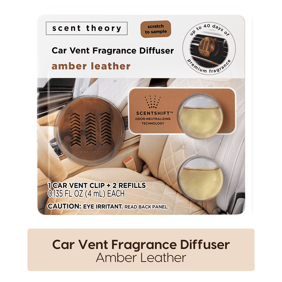 Scent Theory amber leather car vent fragrance diffuser pack showing clip and two refill pods on quilted car seat background