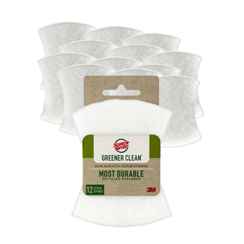 Packaged white Scotch-Brite Greener Clean non-scratch scrub sponge with visible kraft-style label and stacked sponges behind