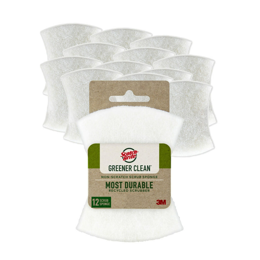 Packaged white Scotch-Brite Greener Clean non-scratch scrub sponge with visible kraft-style label and stacked sponges behind