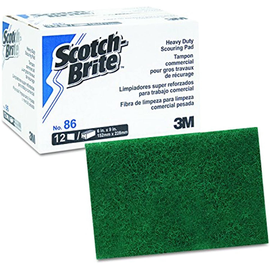 Scotch-Brite branded box next to a green scouring pad showing product packaging and pad detail