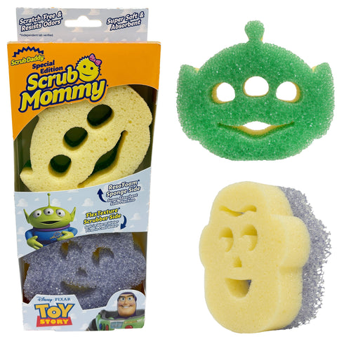 Packaged Scrub Mommy special edition Toy Story sponge set with yellow character sponge and purple scrubby visible in box