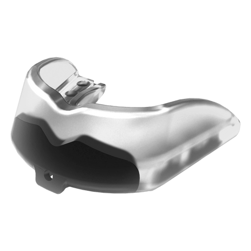 Close-up clear athletic mouthguard showing layered internal structure and curved bite surface in high-contrast lighting.
