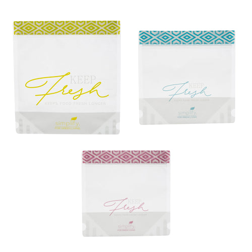 Three clear reusable stand-up snack bags with patterned colored zip strips and ‘Keep Fresh’ print.