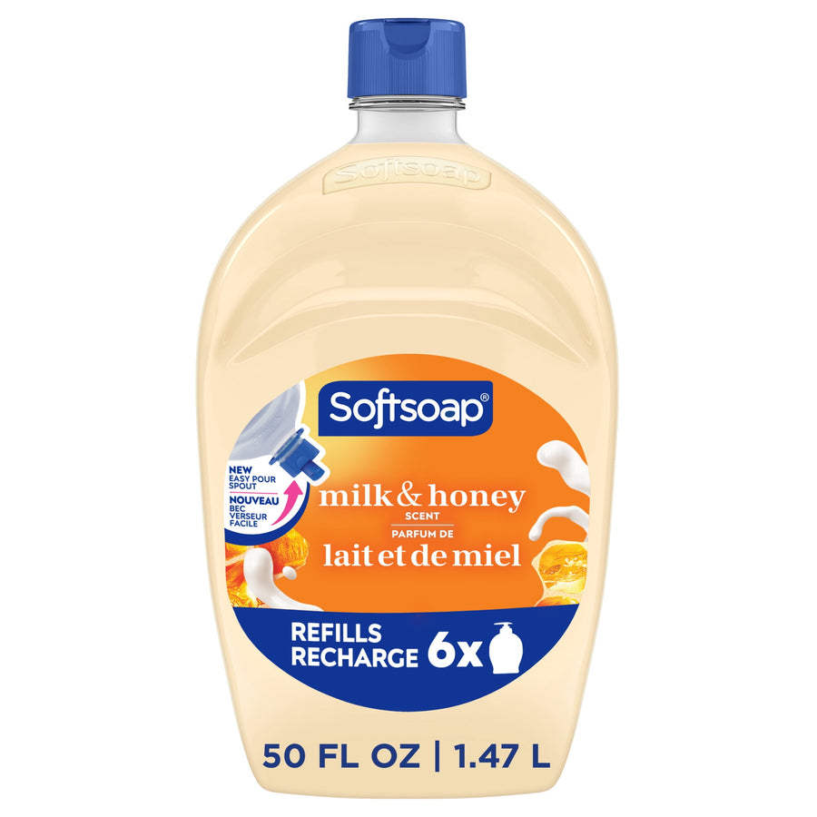 Softsoap milk & honey refill bottle with orange label and blue cap on white background