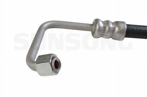 Close-up of a metal hose end and angled steel tube with hex nut on a black power steering hose, Sunsong watermark