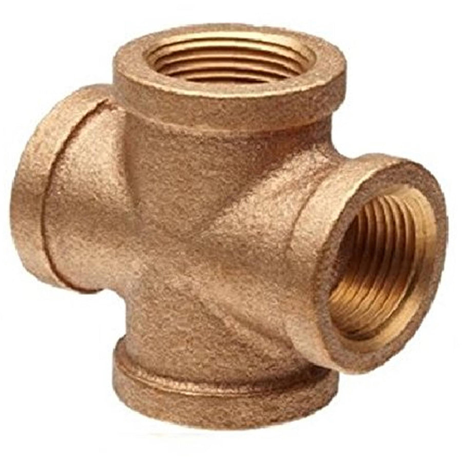 Close-up of a threaded brass 4-way plumbing cross fitting with textured finish