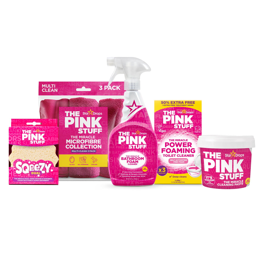 Assorted The Pink Stuff bathroom cleaning products arranged together on white background
