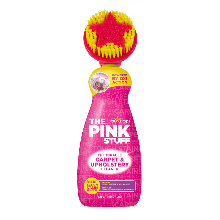 Bottle of The Pink Stuff carpet and upholstery cleaner with built-in star brush shown on white background