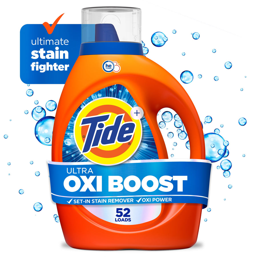 Close-up product shot of an orange Tide Ultra Oxi Boost liquid detergent bottle with blue label and water-bubble graphics.