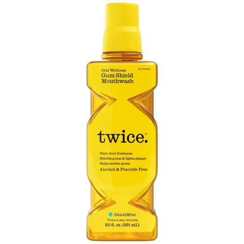Single yellow bottle of Twice Gum Shield mouthwash on white background showing label and cap