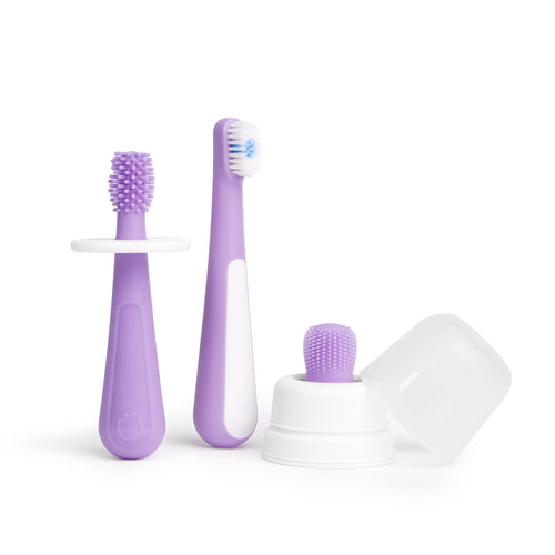 Three-piece purple baby toothbrush set shown on white background with silicone finger brush and cap