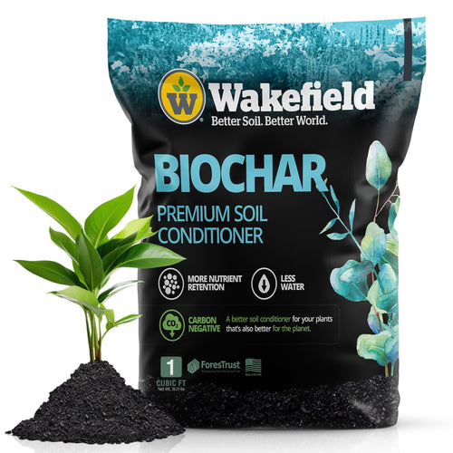 Bag of Wakefield Biochar premium soil conditioner next to a small mound of black biochar and a green seedling.