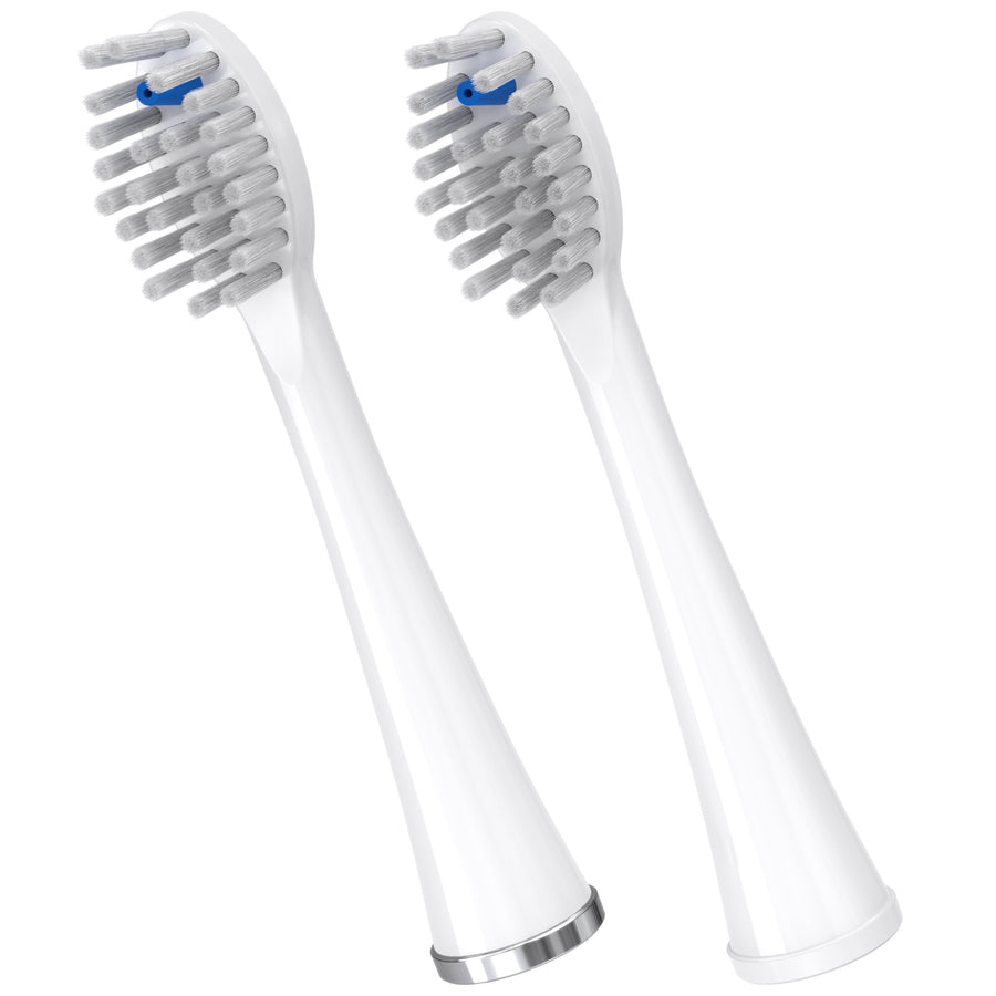 Two white Waterpik replacement toothbrush heads with angled bristle clusters and blue indicator bristle, isolated on white.