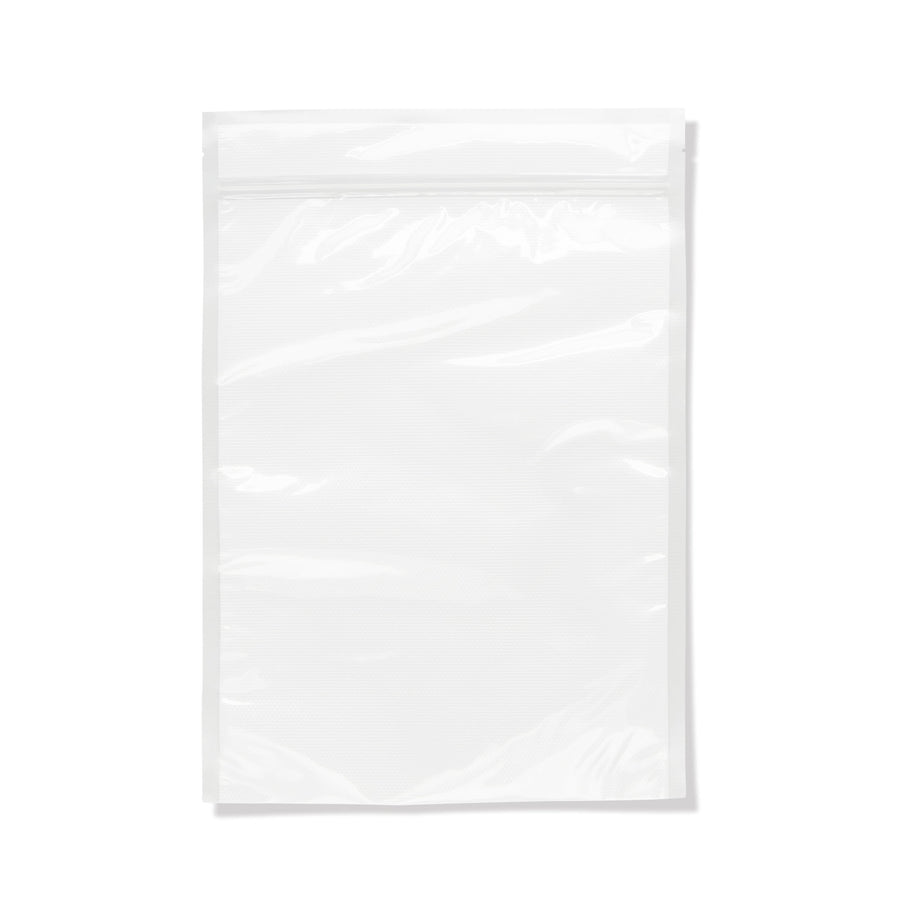 Clear resealable vacuum sealer bag with textured interior and zip lock top on white background