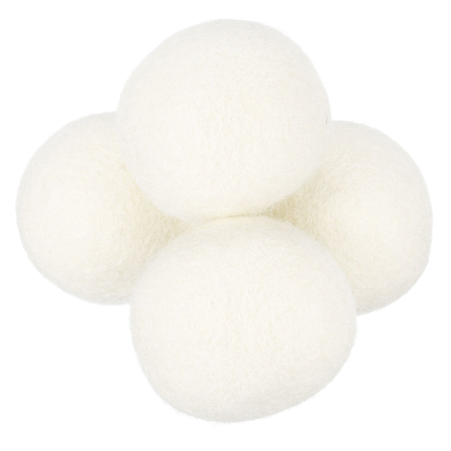Cluster of four white wool dryer balls on a white background, showing felted texture.