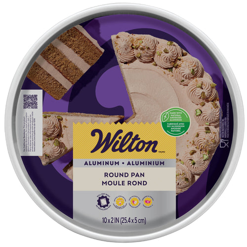 Top-down view of Wilton branded packaging showing a frosted cake with a slice removed inside a round aluminum pan label.