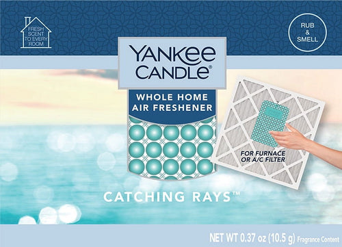 Yankee Candle blue-themed Catching Rays whole home air freshener packaging with product window and ocean background.