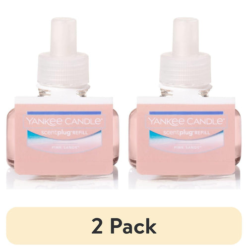 Two pink Yankee Candle ScentPlug refill bottles with white caps shown side by side on a white background.