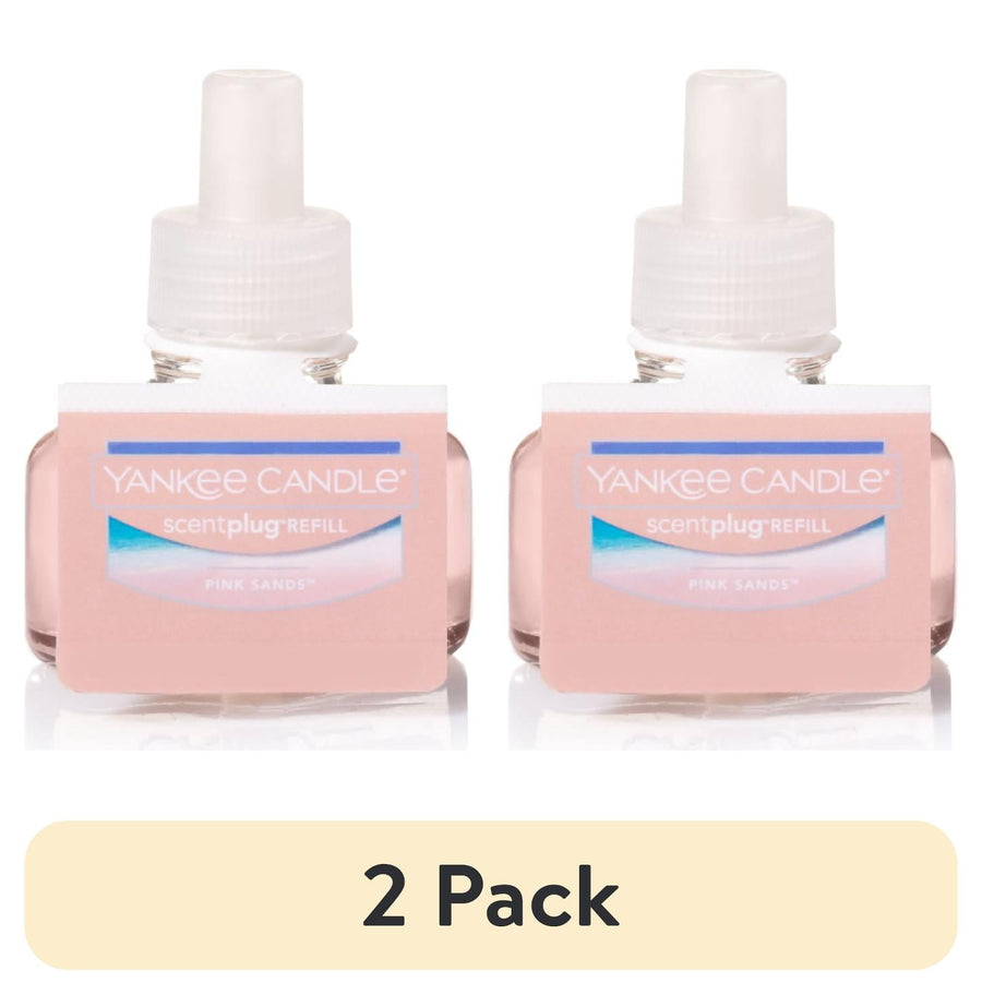 Two pink Yankee Candle ScentPlug refill bottles with white caps shown side by side on a white background.
