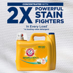 Arm & Hammer Sensitive Skin detergent jug beneath large text '2X powerful stain fighters' on textured background