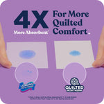 Absorbency comparison showing two paper squares with blue liquid and '4X More Absorbent' Quilted Northern branding