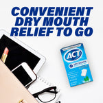 Flat-lay scene with ACT Dry Mouth Moisturizing Gum box alongside glasses, phone and tablet with headline convenient dry mouth relief to go