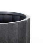 Close-up detail of the textured rim and fluted side of a charcoal resin planter