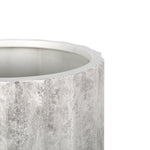 Close-up of the planter rim and textured gray gypsum surface showing fluted vertical detailing