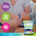 Close lifestyle image of an adult putting a blue coiled Bugables citronella wristband on a child, with product pouch and feature bubbles visible.