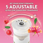 Close-up of an Air Wick plug-in control dial with graphic text '5 adjustable' scent strength and raspberry and honeysuckle accents