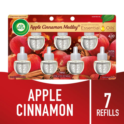 Air Wick Apple Cinnamon Medley refill blister pack showing seven clear scented oil refill pods over apple and cinnamon background