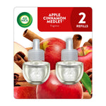 Air Wick apple cinnamon medley scented oil refill twin bottles on product blister card with apples and cinnamon sticks graphic