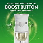 Air Wick plug-in warmer highlighting a central boost button with instructions for instant fragrance