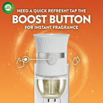 Air Wick plug-in warmer showing the boost button callout and text 'Need a quick refresh? Tap the boost button'