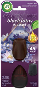 Close-up of Air Wick Essential Mist black lotus & violet packaging with ribbed brown cap and floral graphics