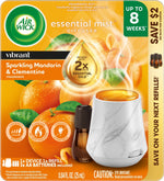 Air Wick essential mist diffuser package front with marble-effect device, refill bottle and sparkling mandarin artwork
