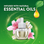 Single Air Wick refill bottle with lilies and essential oil droplet on a green promotional background