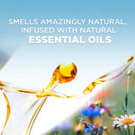 Graphic of golden oil drops and blurred wildflowers with text highlighting that the product is infused with natural essential oils.