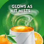 Top-lit marble diffuser cap glowing with mist illustration and text 'Glows as it mists' against a green swirling background.
