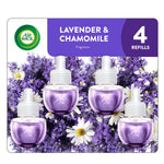 Air Wick Lavender & Chamomile packaging showing four purple plug-in oil refills over a bed of lavender and chamomile flowers.