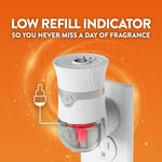 Air Wick plug-in device inserted in outlet showing illuminated low refill indicator and text about the indicator feature